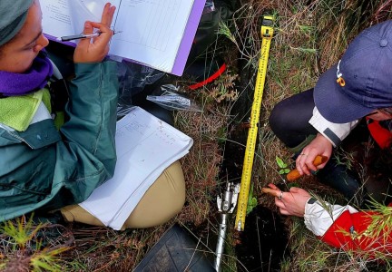 Rabia and Kaeli describing and subsampling peat core Rotoeka 031223 1