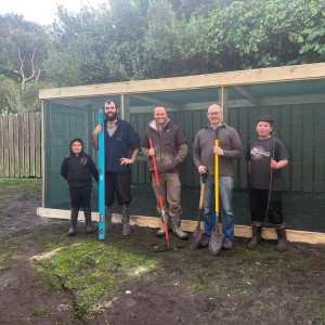 Troy Tuhiwai Rodgers Hamish Chisholm Mike Bell Philip Graydon and Liam Tuhiwai Rodgers stand in front of the newly completed shade house for the native nursery at Kaingaroa School