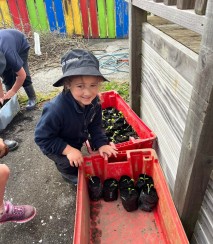 Kid helping in the native plant nursery